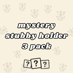 MYSTERY: THREE STUBBY HOLDER PACK